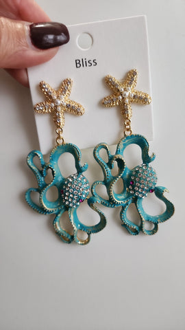 618-10-Aretes Estrellas y Caracol