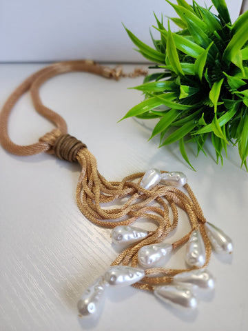 # 123- Collar de perlas