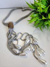 # 123- Collar de perlas