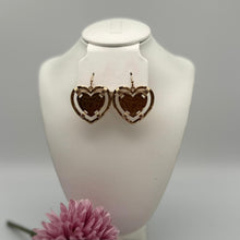 A135-Aretes de corazón amarrado